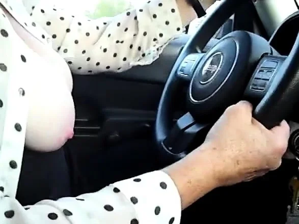 Girl Driving around town with Tits Out