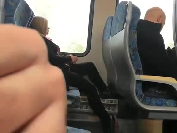 Guy plays with his cock next to female passenger