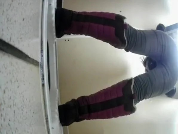 Woman squats and pees