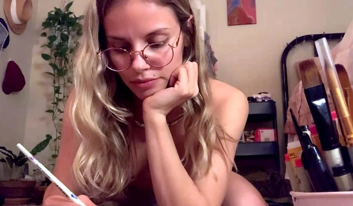 Blonde teen in solo action with her pussy