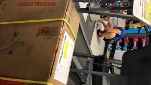 Woman in fitness section upskirted