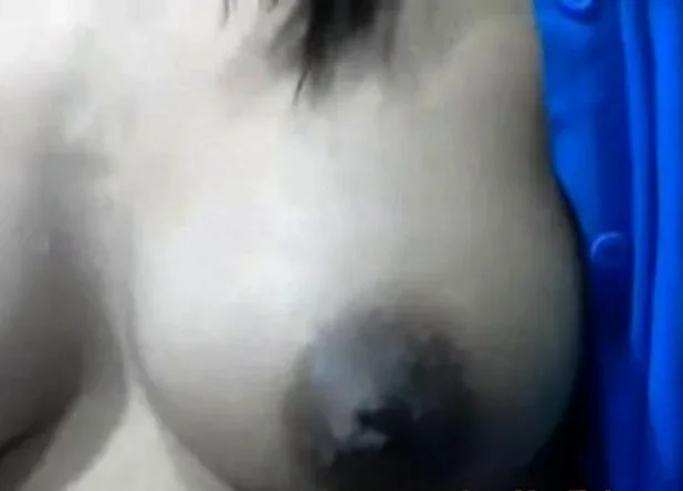 Squeezes out milk from her dark nip ttis